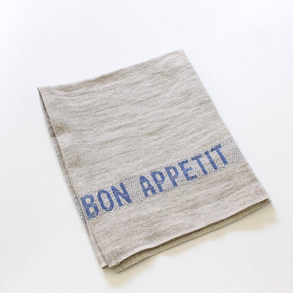 Serviette Bon Appetit aus Leinen natur mit blau gewebten Schriftzug