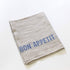 Serviette Bon Appetit aus Leinen natur mit blau gewebten Schriftzug