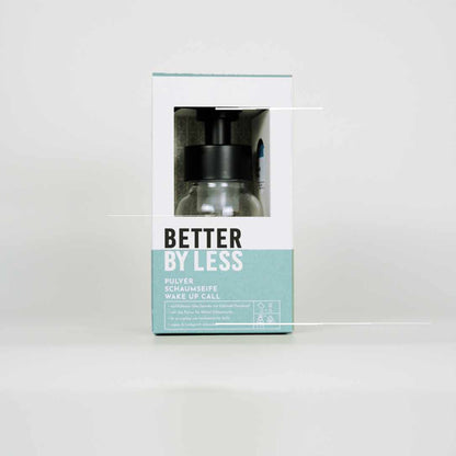 Packung mit Schaumspender in  Klar- Glas und schwarzem Spender mit Schaumpulver mit Duftrichtung wake up call